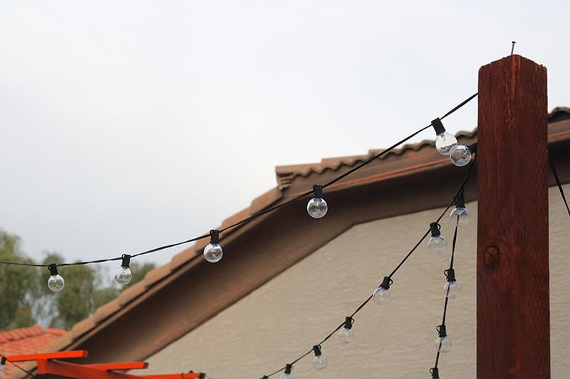 string lights on a wooden post