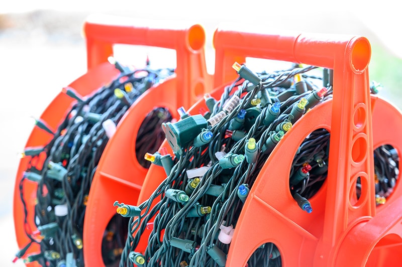 stringed Christmas lights in storage on spool
