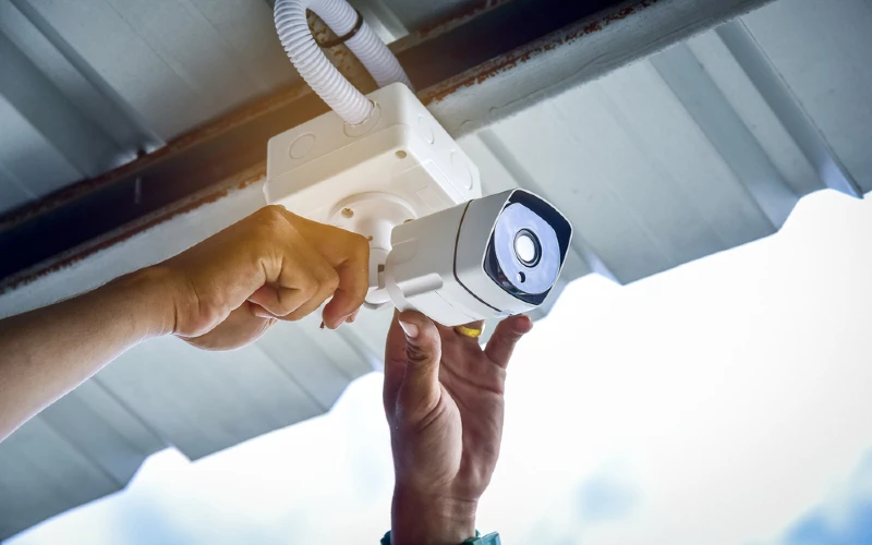 technician installing CCTV camera home security system