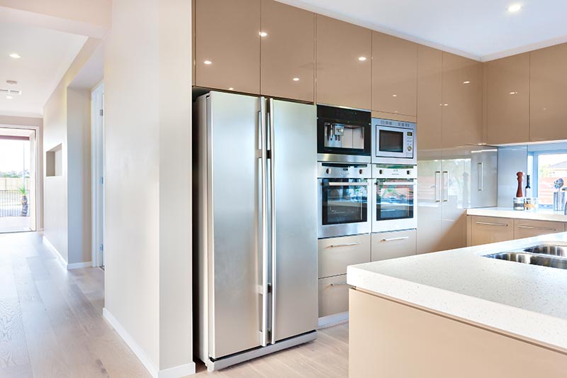 two door refrigerator and four ovens