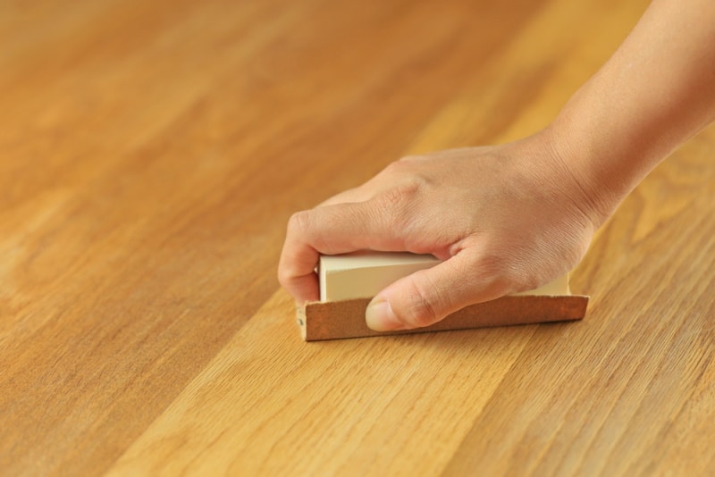 using sandpaper on wooden floor