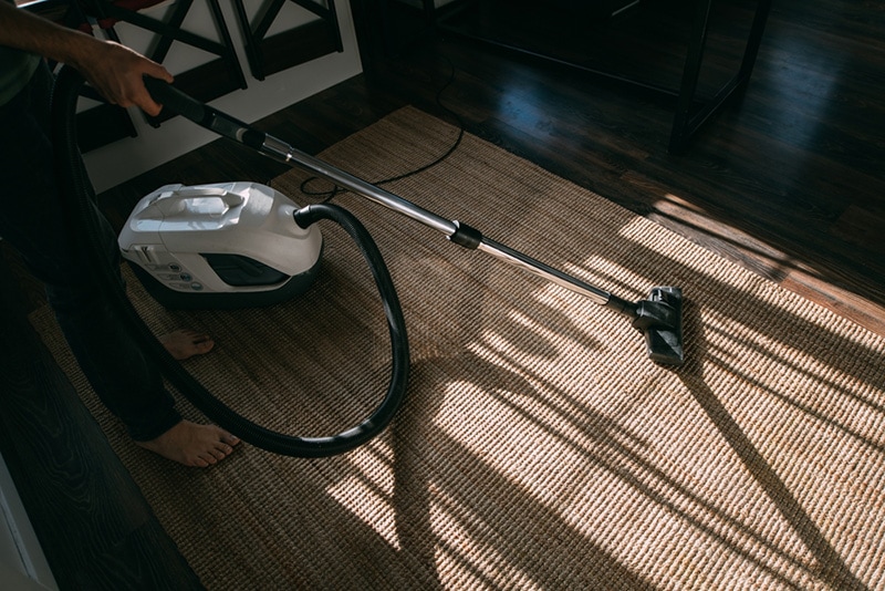 vacuum cleaning the jute rug