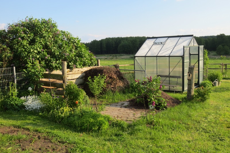 A small greenhouse in the open field