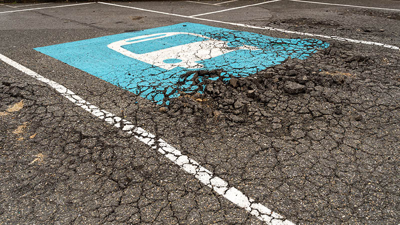 Damaged pavement in parking lot