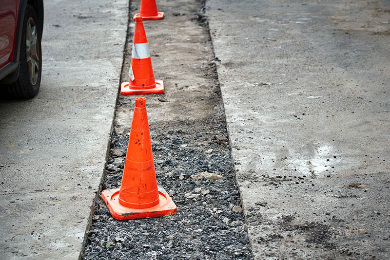 Repair pothole in asphalt pavement