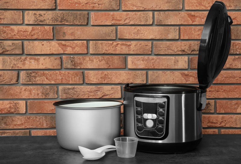 Rice cooker with parts set on table