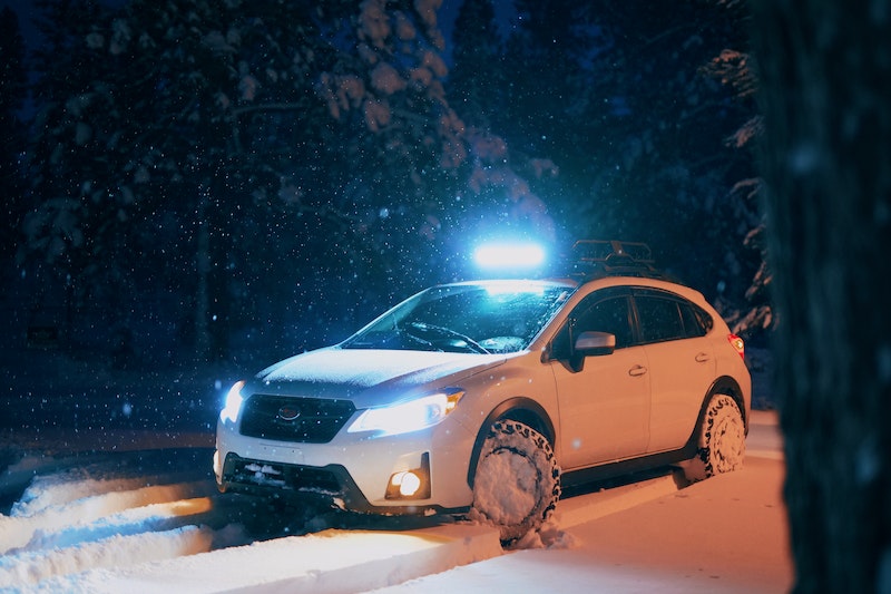SUV with snow tires and halogen lights
