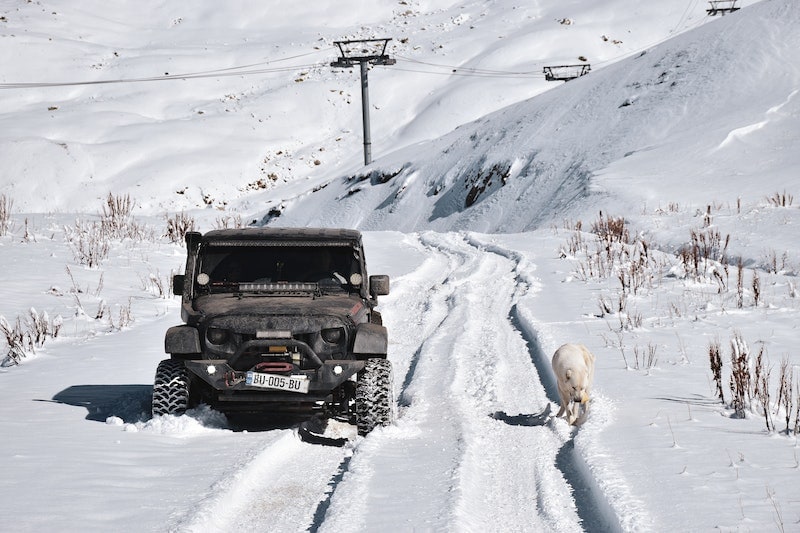 Truck in the snow with big tires