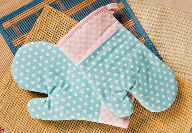 a pair of dotted oven mitts
