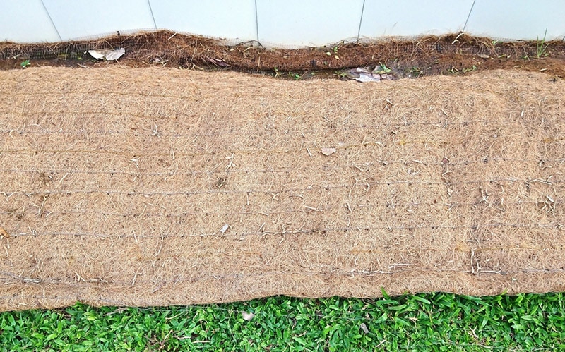 biodegradable soil erosion control blanket placed on the strip of turf area