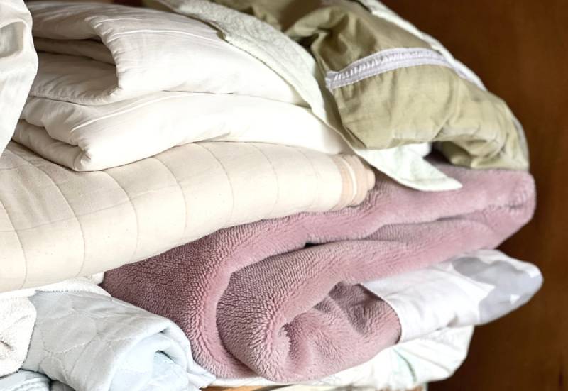 blankets in a cabinet