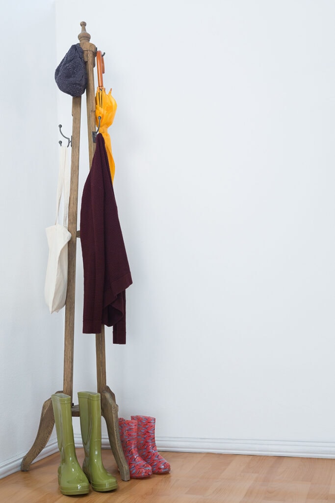 coat rack in the corner of the room