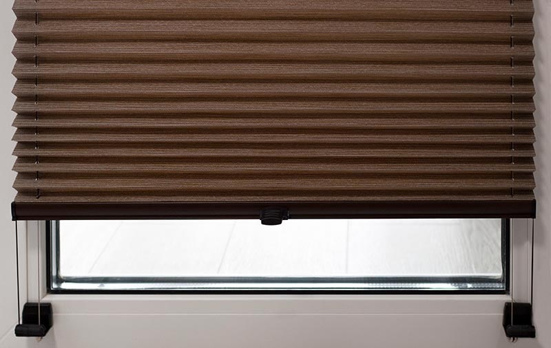cordless pleated modern shades on apartment windows
