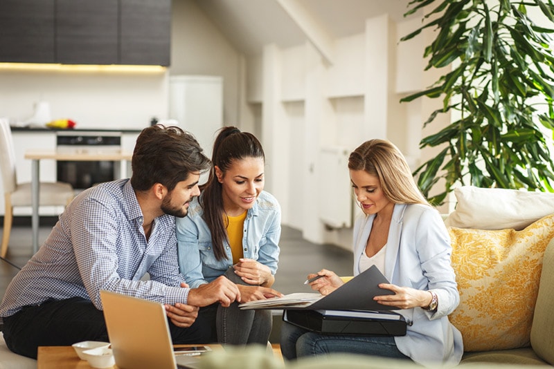 couple talking to a real estate agent