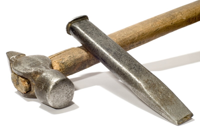 hammer and chisel in white background
