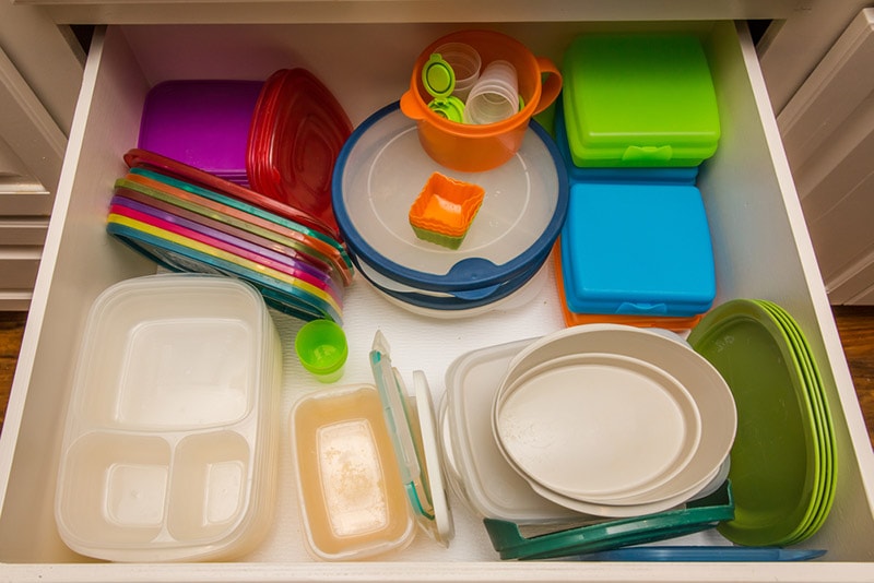 kitchen drawer filled with plastic containers
