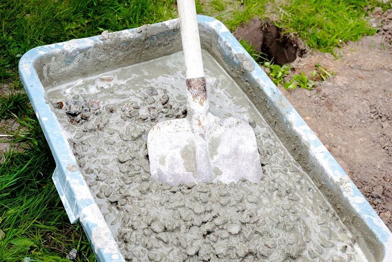 mixing concrete rubble mortar with shovel