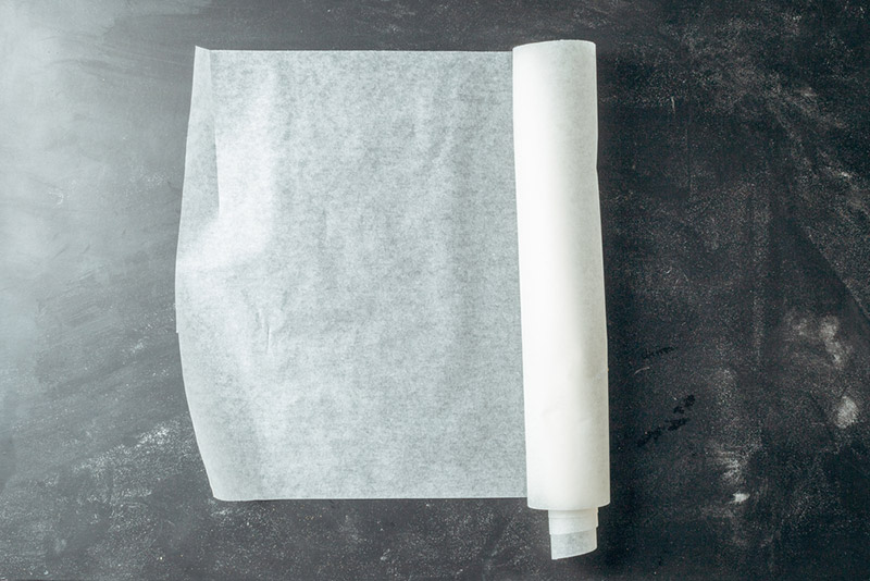 parchment paper on wooden kitchen table