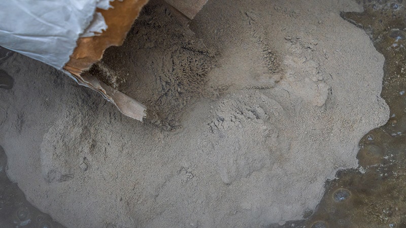 pouring mortar cement in the mixer
