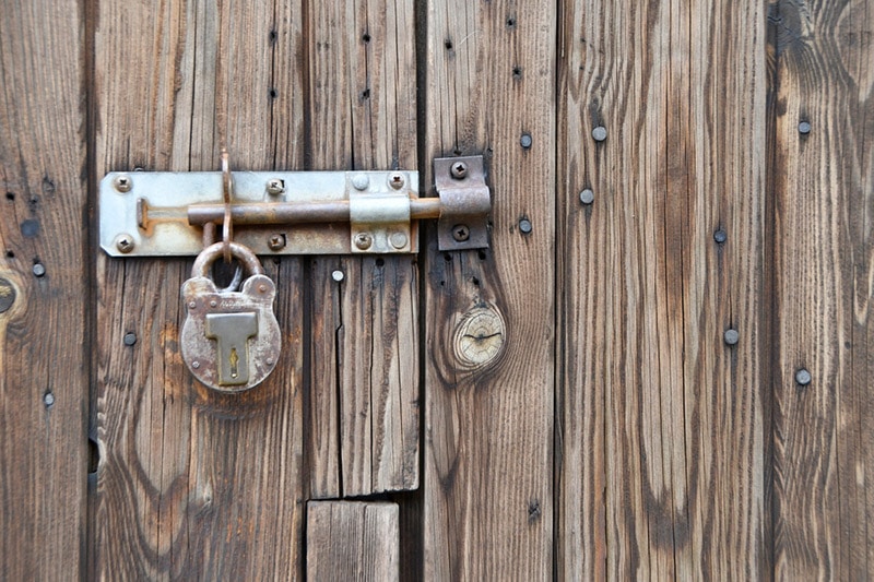 shed door bolted and padlocked securely shut