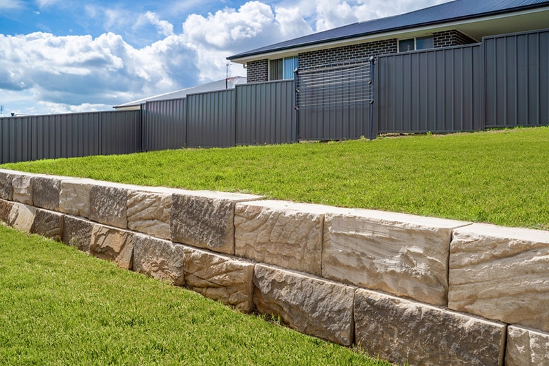 stone retaining wall in the yard