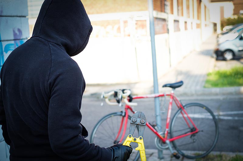 thief stealing a bike
