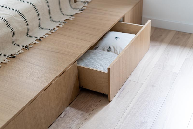 white pillow under bed storage
