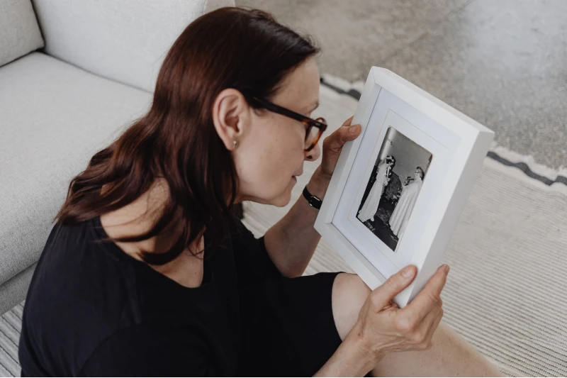 woman holding a picture frame
