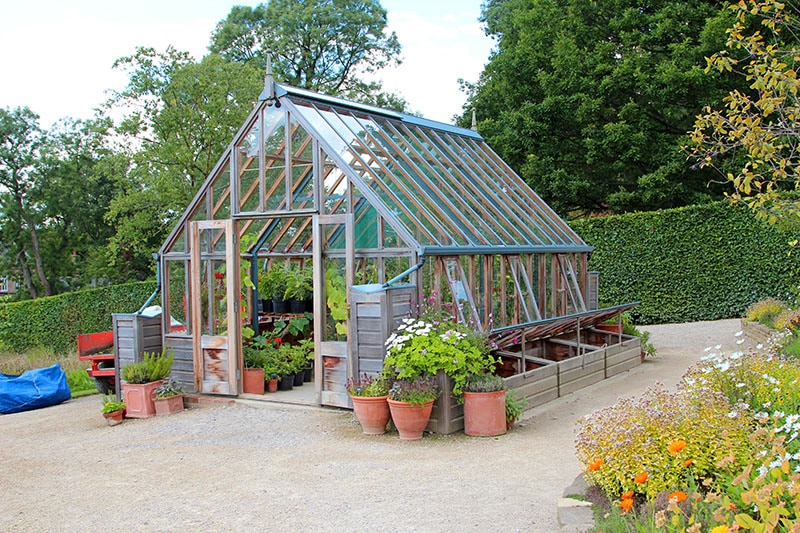 garden greenhouse with cold frame and pots