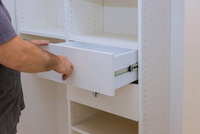 man pulling drawer