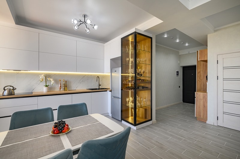 A modern white studio with a kitchen that is fully equipped and ready to use interior design