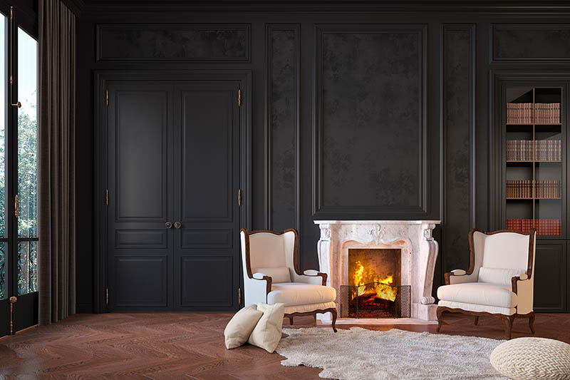 Classic black interior with fireplace, armchairs, moldings, wall pannel, carpet, fur