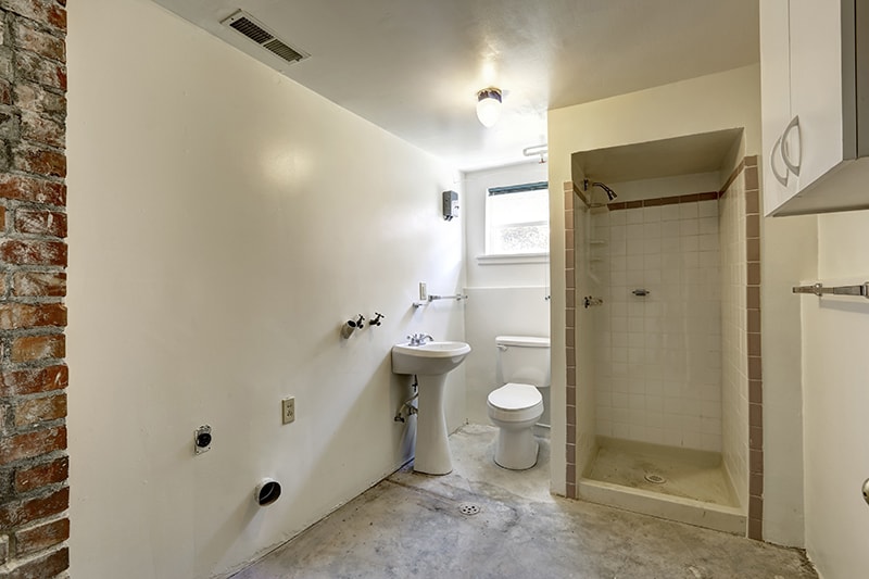 Empty white bathroom under construction