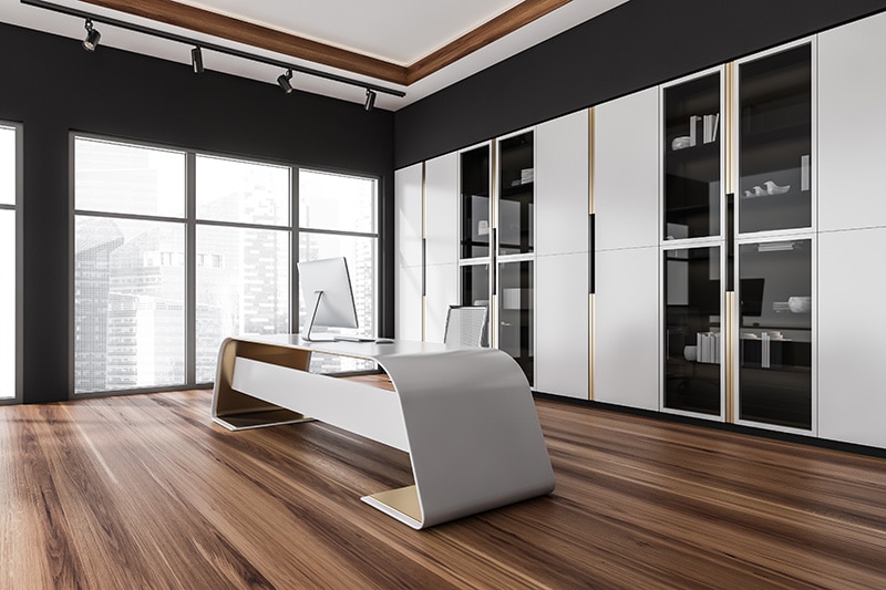 Futuristic black and white CEO office interior with classy desk