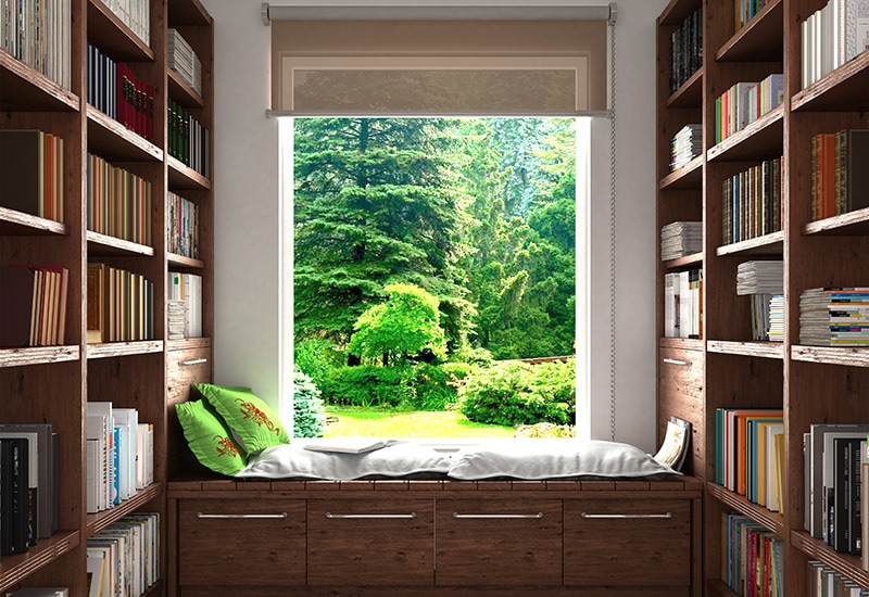 Home reading concept. Wooden shelves full of book in home library