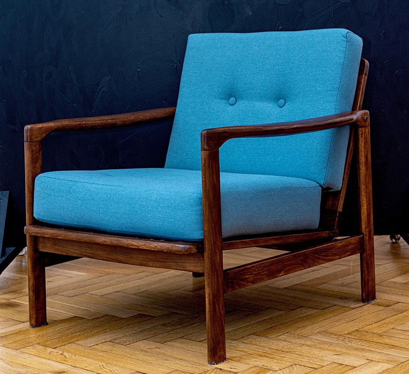 Lounge Chair in blue fabric from 1960s standing on the black background