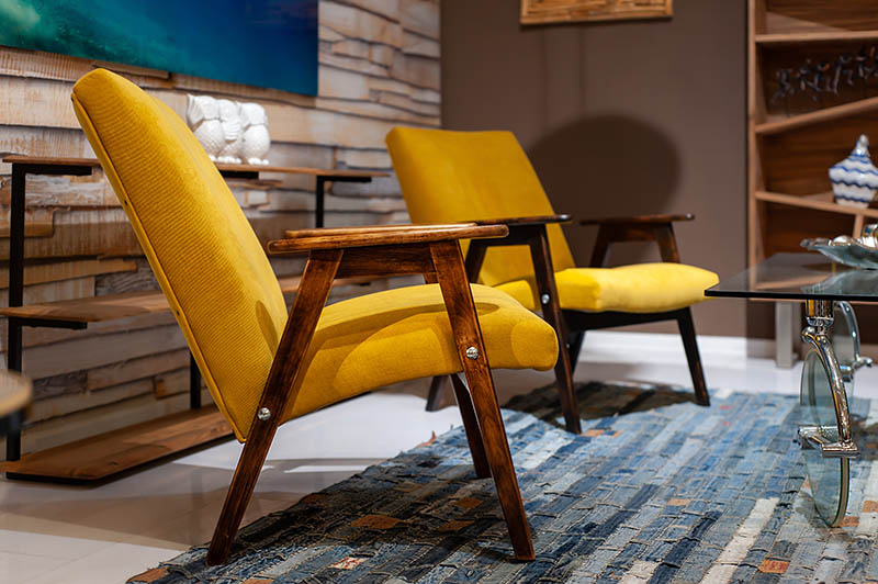 Nice yellow arm chairs from 60s-70s in stylish contemporary hotel or living room interior