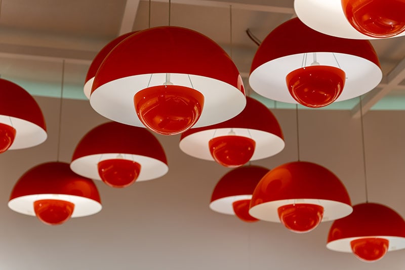 Set of modern pendant lamps with red white shades and red bulbs