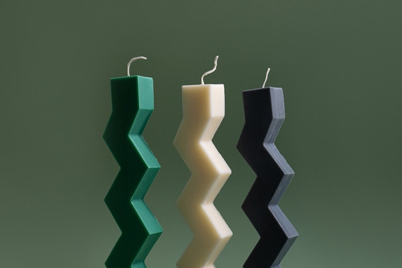 Zigzag shape soy candle on green background