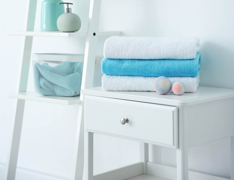 Bathroom interior with clean towels and toiletries