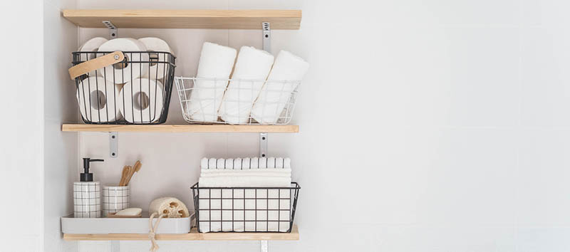 Beautiful white bathroom with white towel and tissues