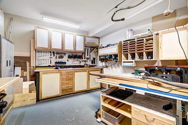 Garage workshop for cabinet making and wood working with tools and equipment