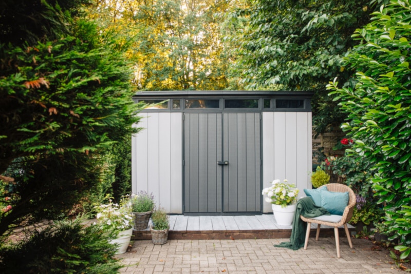 Gray garden shed in the summer