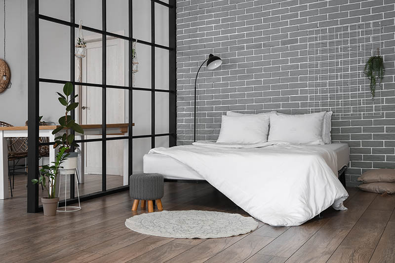 Interior of stylish bedroom with folding screen