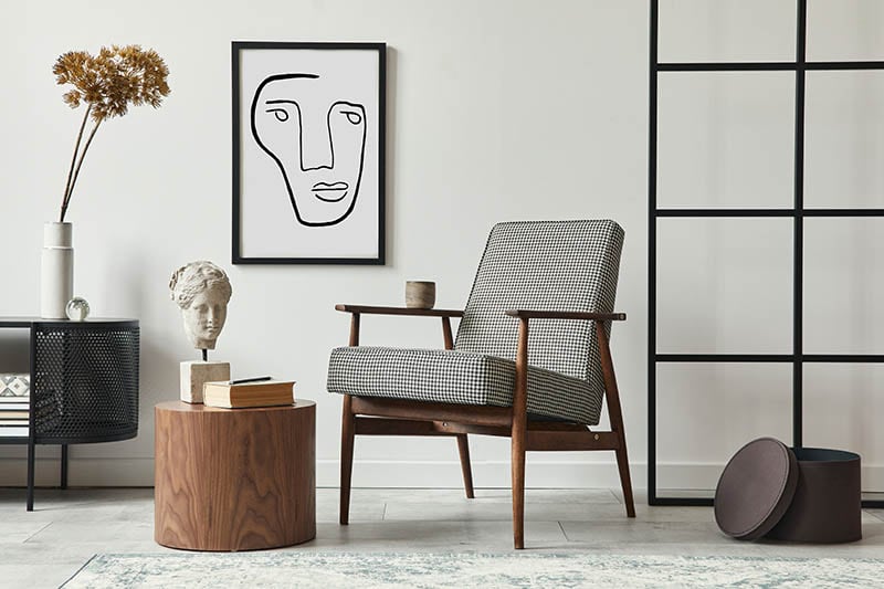 Stylish scandinavian composition of living room with design armchair