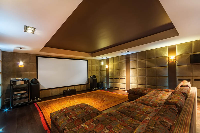 The interior of a home theater with sound-absorbing beige walls