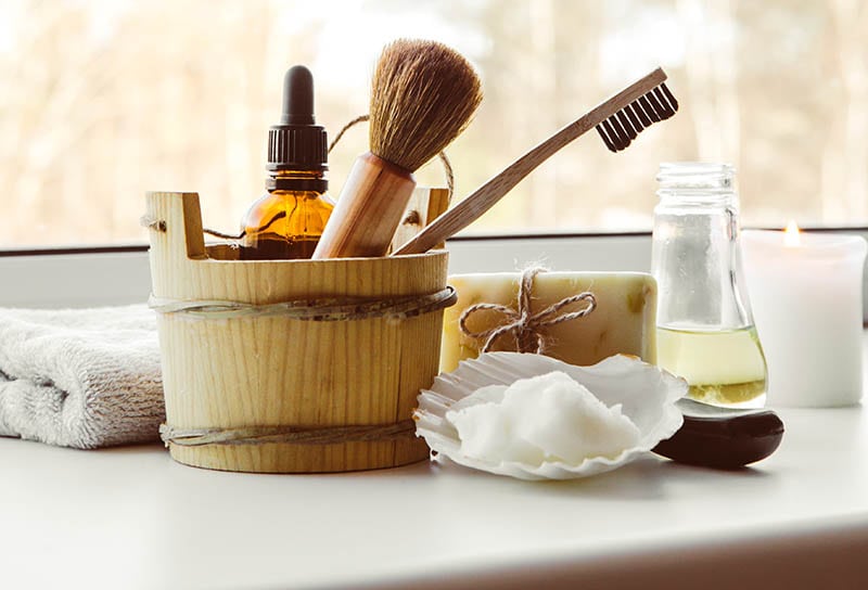 Using natural material beauty cosmetic products in bathroom, window sill