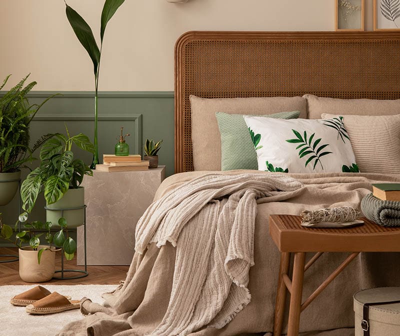 Warm and cozy bedroom interior with mock up poster frame