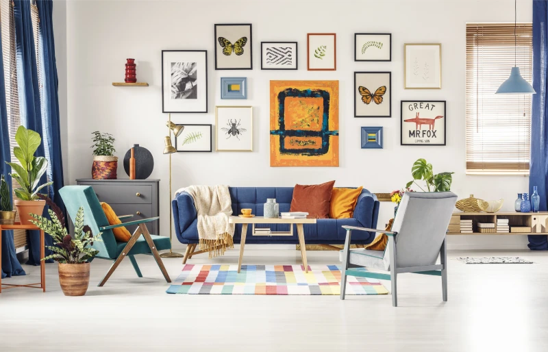 framed artworks on the wall in a bright living room interior