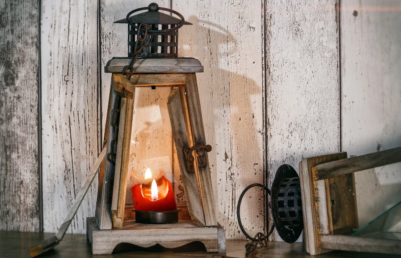 red candle in wood lantern